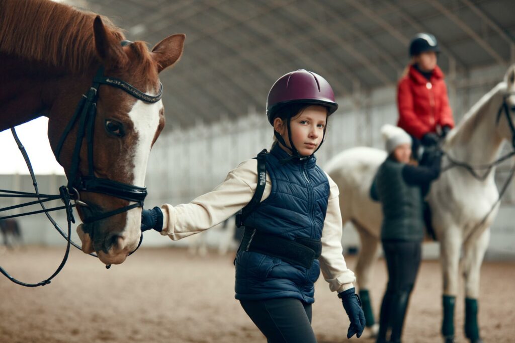 A Child Leading a Horse during Basic Equestrian First Aid Training