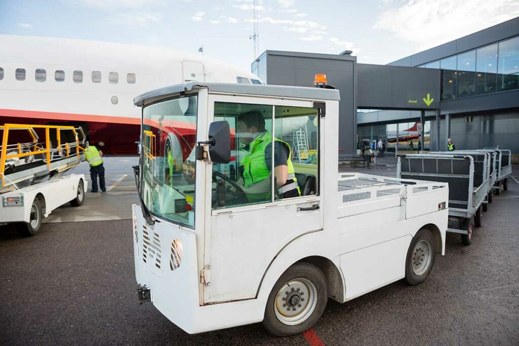 Tow Tractor being used at an Airport